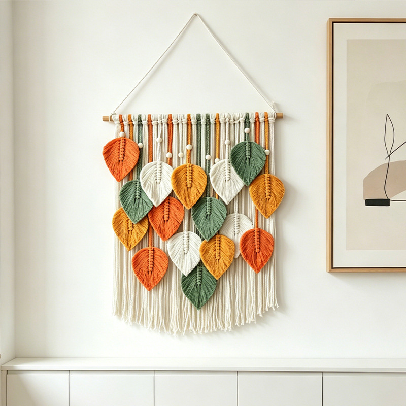 Colorful woven leaf wall hanging in a home decor setting